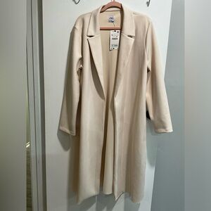 Cream colored trench coat. Extremely Soft!